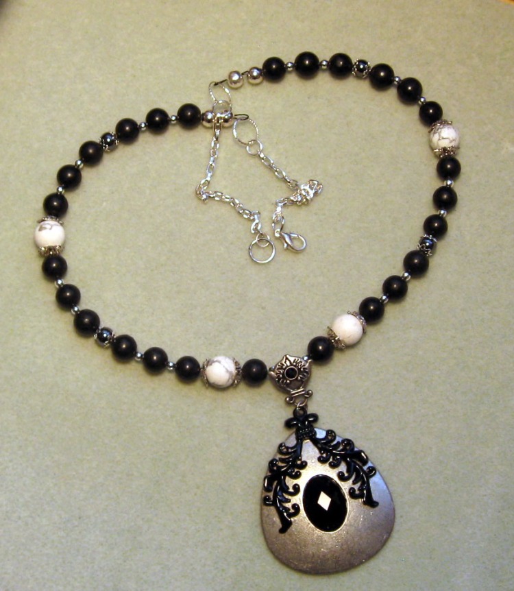 Blackand White beaded necklace with large metal pendant, designed by Catherine Chant