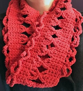 A red rectangular cowl crochet with fuzzy yarn